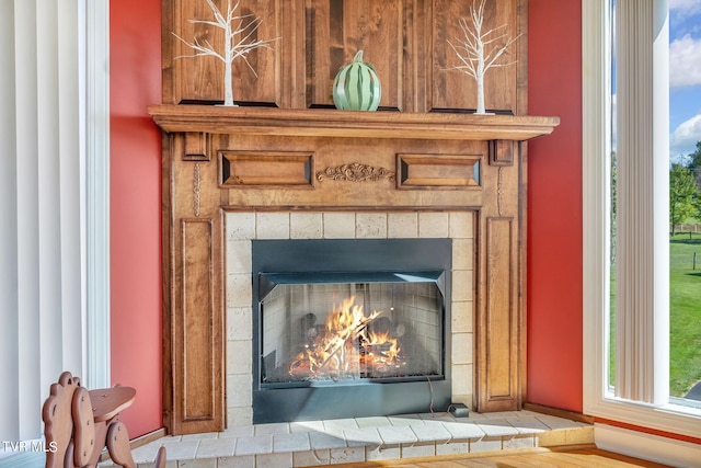 room details featuring a tile fireplace