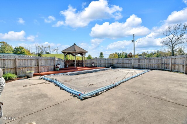 view of pool featuring a gazebo and a patio