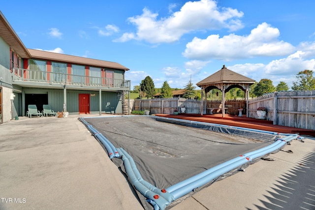 view of swimming pool with a gazebo and a patio