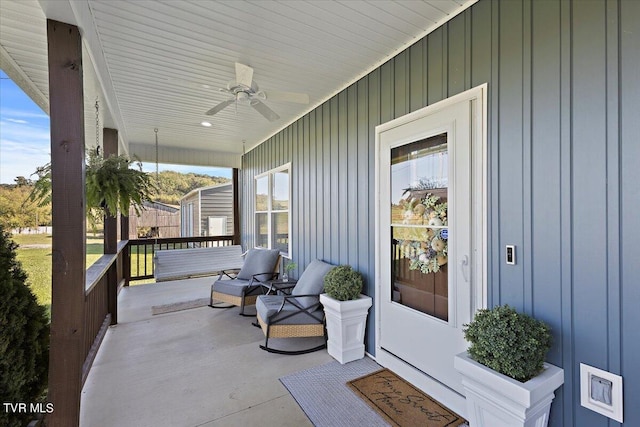 view of patio featuring ceiling fan and a porch