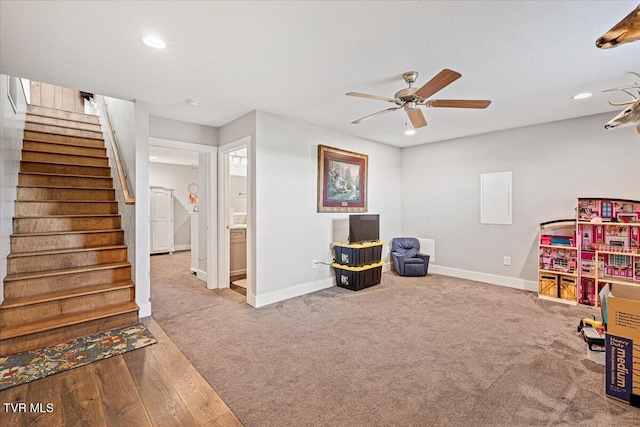 recreation room with wood-type flooring and ceiling fan