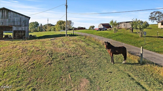 exterior space with a rural view and an outdoor structure