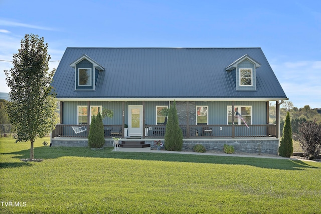 cape cod house featuring a front lawn and covered porch