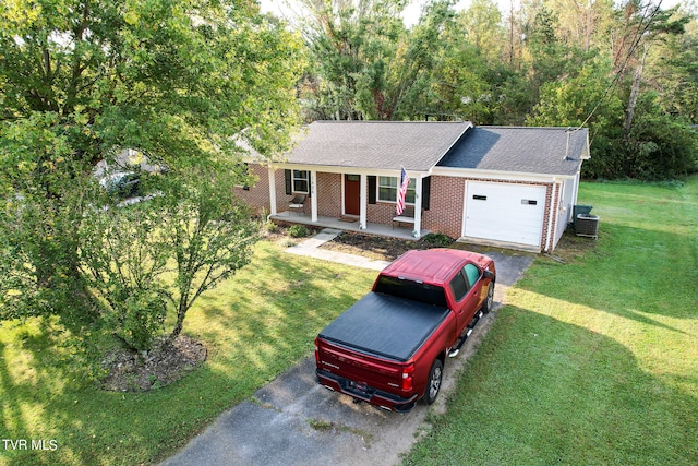 view of front facade featuring a front lawn, a porch, and a garage