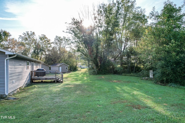 view of yard featuring a wooden deck