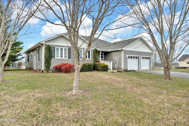 single story home featuring a front yard and a garage