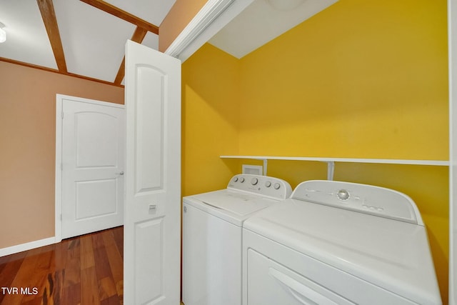 clothes washing area featuring hardwood / wood-style floors and independent washer and dryer