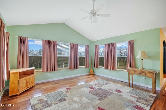 unfurnished sunroom featuring ceiling fan and lofted ceiling