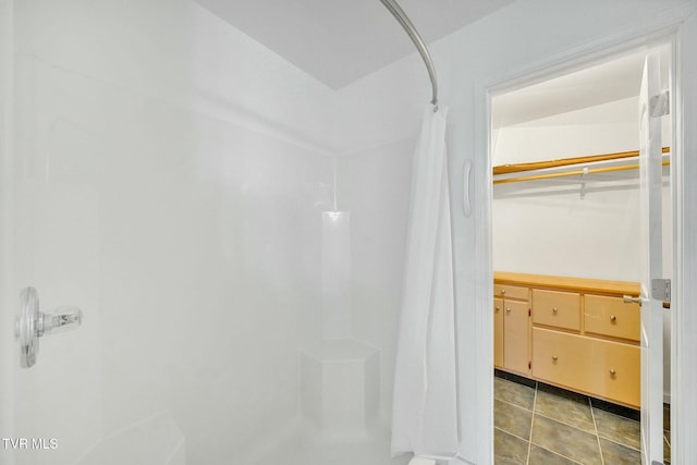 bathroom featuring walk in shower