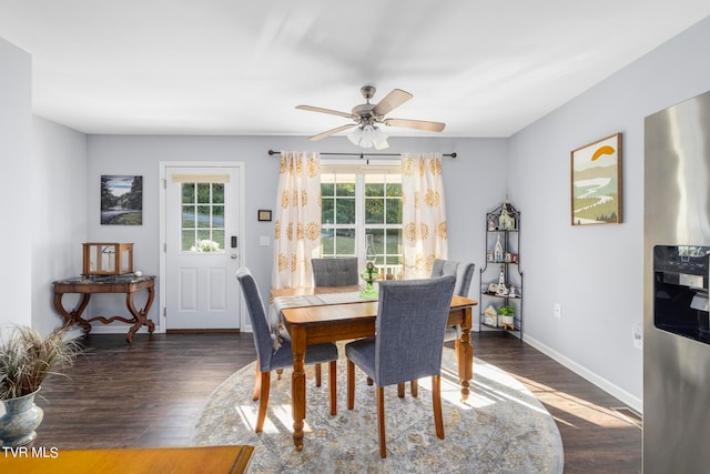 dining area with ceiling fan and dark hardwood / wood-style floors