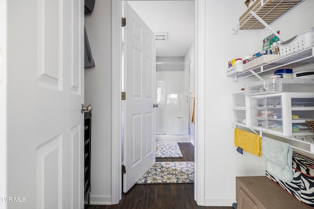 hallway with dark wood-type flooring