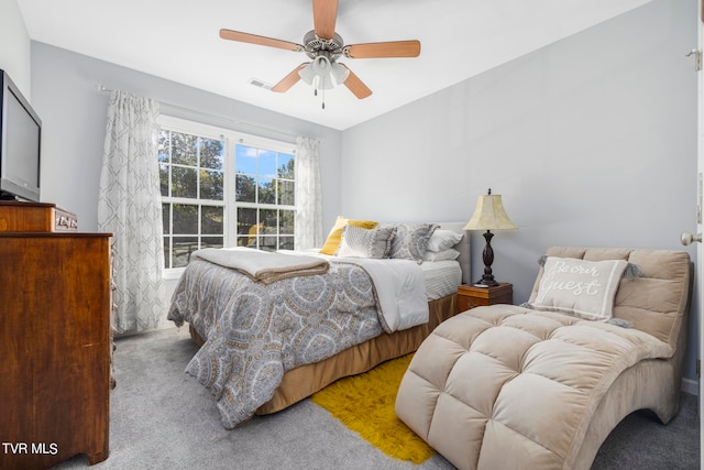 bedroom featuring light colored carpet and ceiling fan