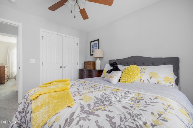 bedroom featuring ceiling fan, a closet, and carpet