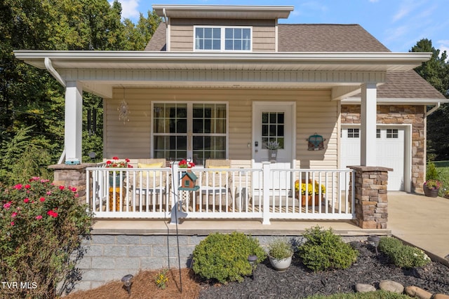 view of front facade with a garage and covered porch