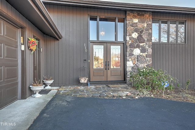 view of exterior entry featuring french doors