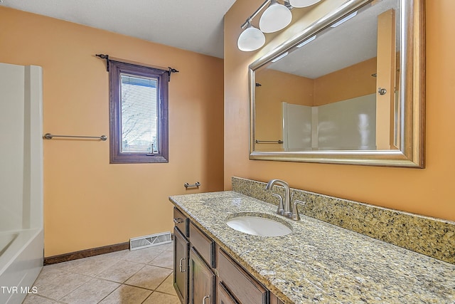 bathroom featuring tile patterned flooring, vanity, and shower / bath combination