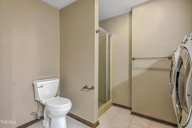 bathroom featuring walk in shower, tile patterned floors, a textured ceiling, and toilet