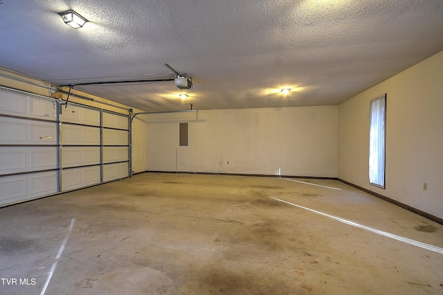 garage with electric panel and a garage door opener