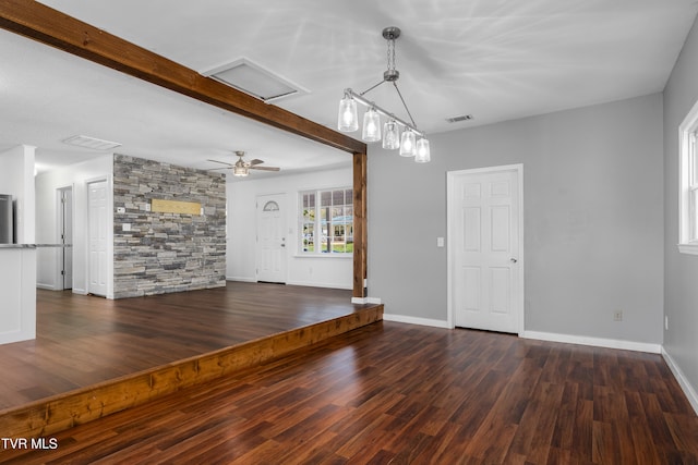 interior space featuring dark wood-type flooring and ceiling fan