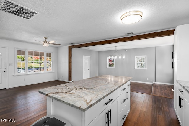 kitchen with white cabinetry and a healthy amount of sunlight