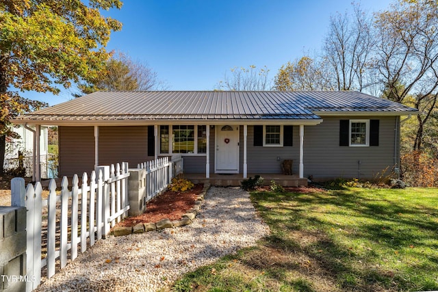 ranch-style house with covered porch and a front lawn