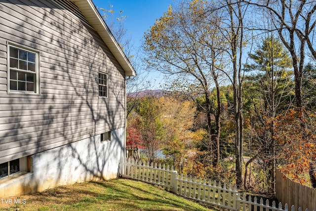 view of home's exterior with a lawn