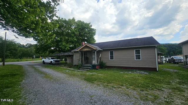 10 Powell Valley Rd, Big Stone Gap, VA 24219 - view of front of property with driveway, a front lawn, and a chimney