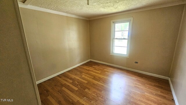 10 Powell Valley Rd, Big Stone Gap, VA 24219 - empty room featuring a textured ceiling and wood finished floors