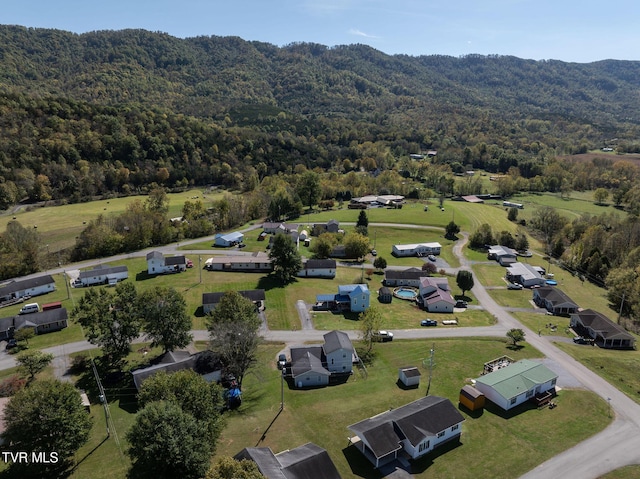 bird's eye view featuring a wooded view