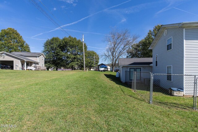 view of yard featuring fence and a gate