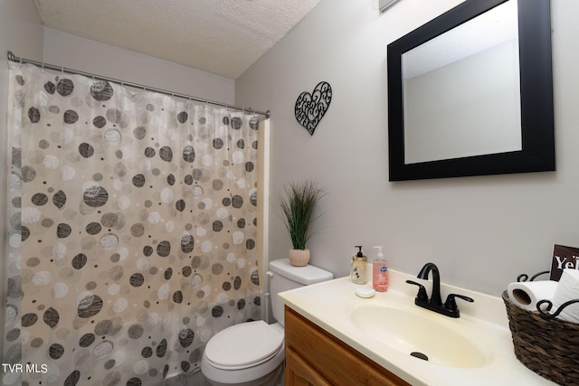 full bathroom with curtained shower, vanity, a textured ceiling, and toilet