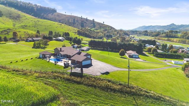 bird's eye view featuring a rural view and a mountain view