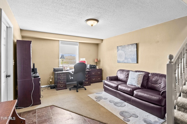 office area with light carpet and a textured ceiling