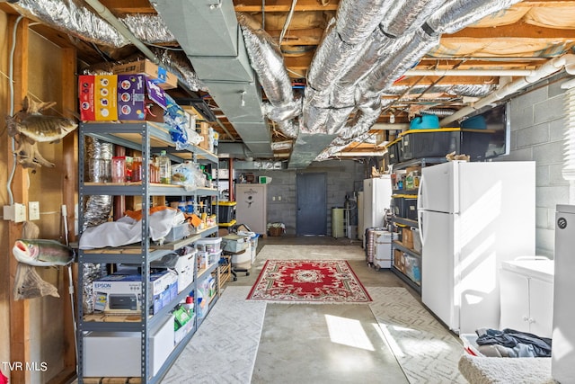 basement featuring white refrigerator