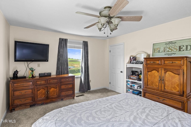 bedroom featuring light carpet and ceiling fan