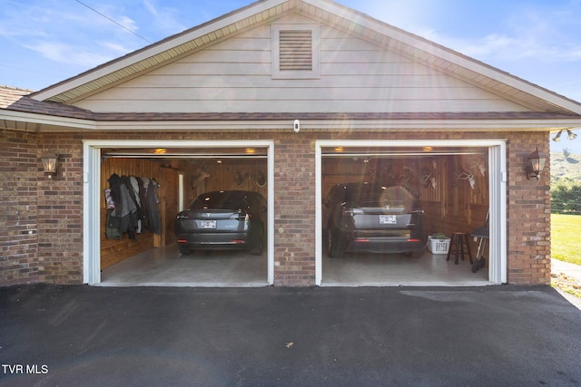 garage featuring wooden walls