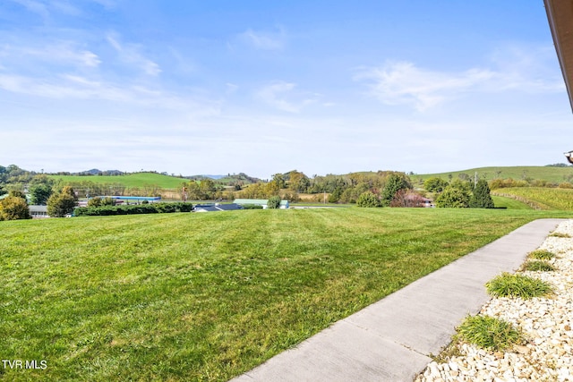 view of yard with a rural view