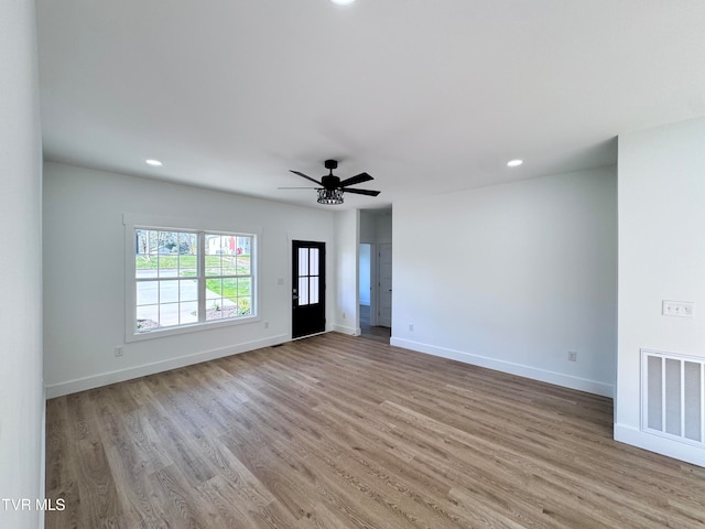 interior space with light hardwood / wood-style floors and ceiling fan