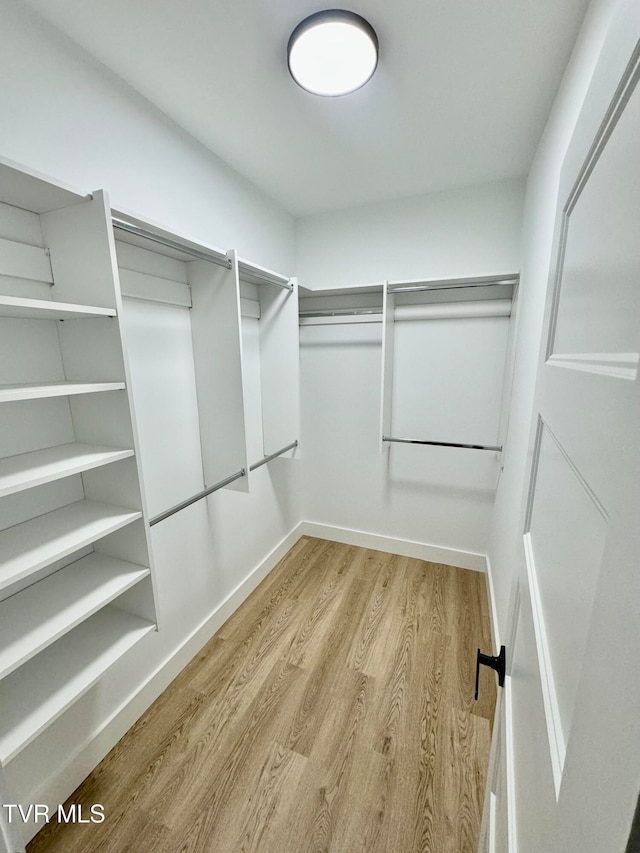 walk in closet featuring light hardwood / wood-style floors