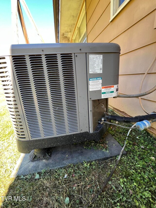 details with central air condition unit and wood walls