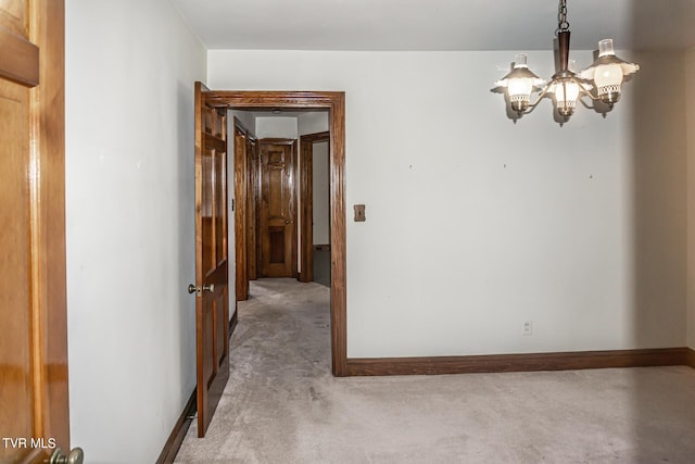 1021 Tusculum Blvd, Greeneville, TN 37745 - interior space featuring light colored carpet, an inviting chandelier, and baseboards