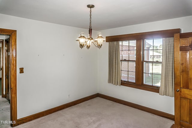 1021 Tusculum Blvd, Greeneville, TN 37745 - carpeted spare room featuring baseboards and a chandelier