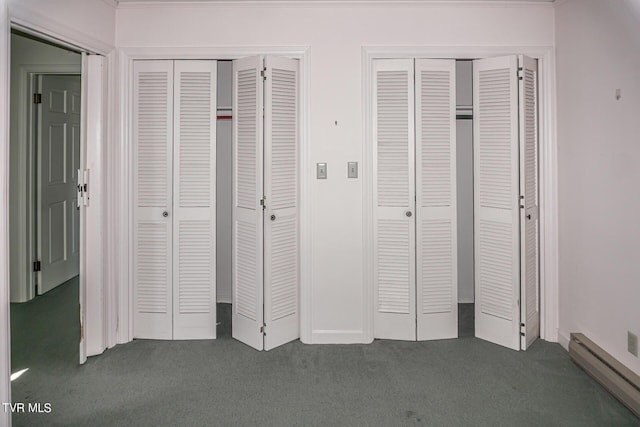 1021 Tusculum Blvd, Greeneville, TN 37745 - unfurnished bedroom with carpet floors, a baseboard heating unit, and multiple closets