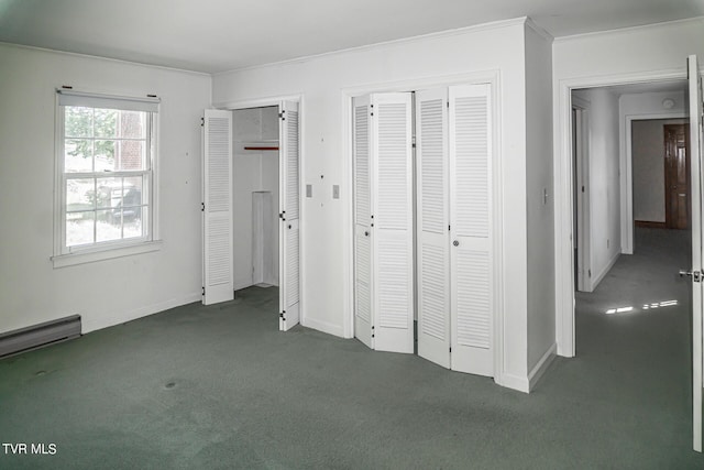 1021 Tusculum Blvd, Greeneville, TN 37745 - unfurnished bedroom with crown molding, carpet floors, multiple closets, and baseboards