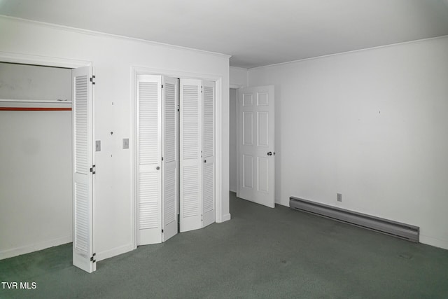 1021 Tusculum Blvd, Greeneville, TN 37745 - unfurnished bedroom with crown molding, a baseboard heating unit, carpet, and multiple closets