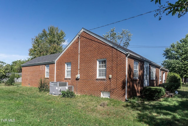 1021 Tusculum Blvd, Greeneville, TN 37745 - view of property exterior with cooling unit, a yard, and brick siding