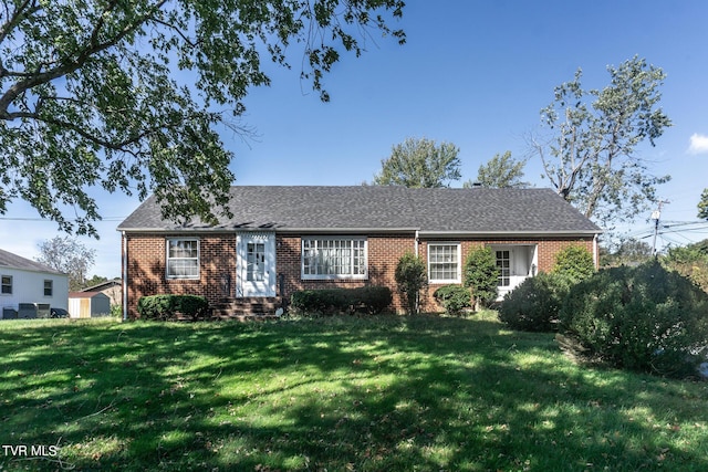 1021 Tusculum Blvd, Greeneville, TN 37745 - ranch-style house with roof with shingles, a front lawn, and brick siding