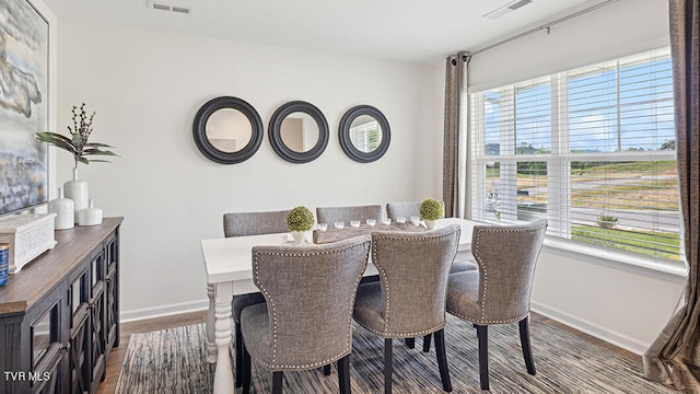 dining area featuring wood-type flooring