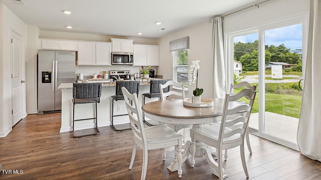 dining area featuring dark hardwood / wood-style flooring