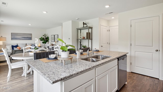 kitchen with white cabinetry, an island with sink, dark hardwood / wood-style flooring, dishwasher, and sink